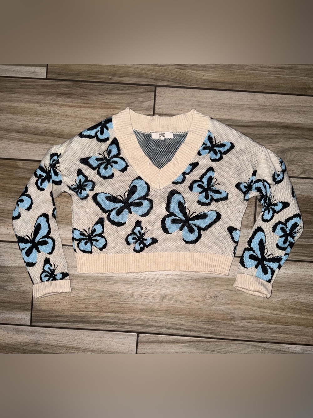 Madden NYC Cream V-Neck Sweater with Blue and Black Butterfly Motif